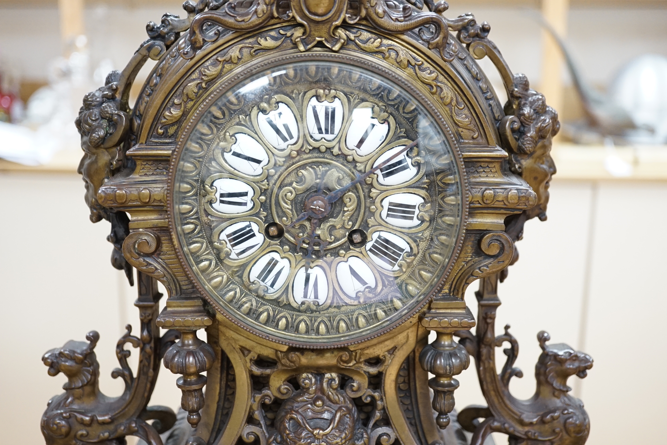 An ornate French bronze clock and five light candelabra garniture, late 19th century, 57cm high